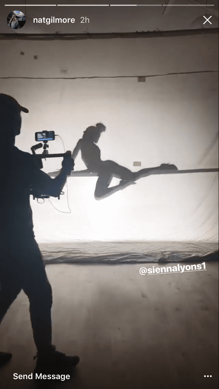 Cameraman silhouette capturing a dancer